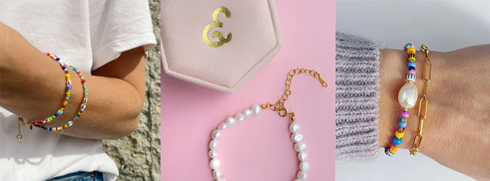 Tre armbånd lavet af perler og farverige sten samt guldkæde.