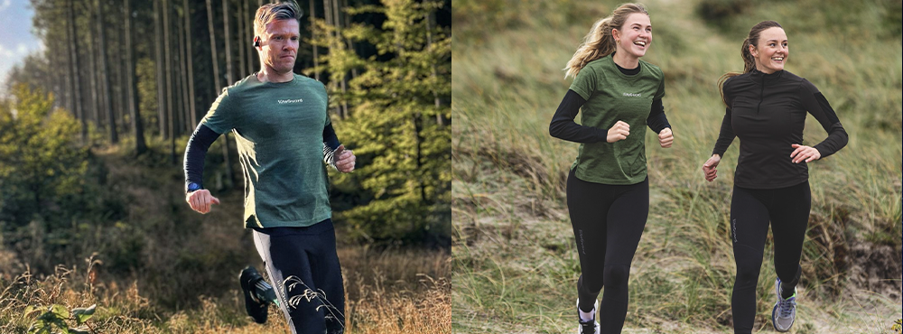 En mand løber i skoven til venstre i billedet, han har sportstøj på fra LiiteGuard. To kvinder løber til højre i billedet, de har også tøj på fra LiiteGuard.